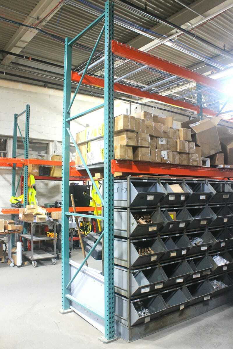 Pallet racking straddling bolt bins